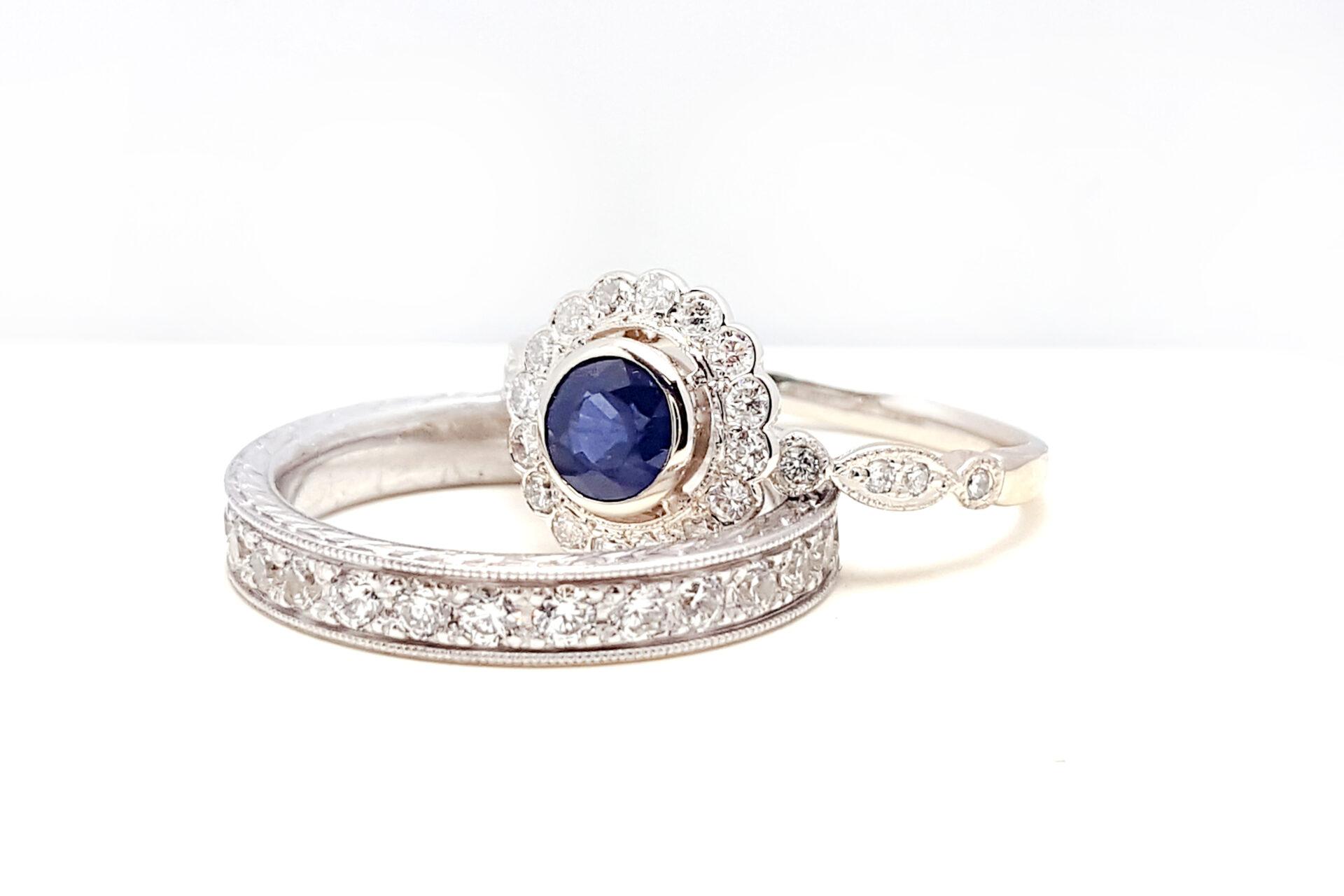 A sophisticated display of gold jewelry and hands on a marble surface, exuding luxury and elegance.